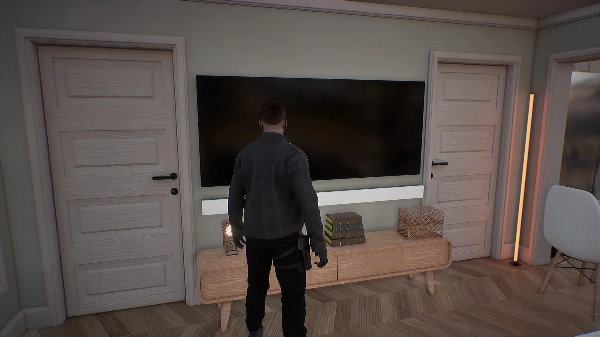 Detective Graham inside a house, standing between two doors